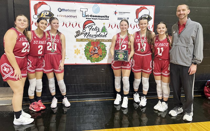 The St. Paul Lady Cardinals took first in the Feliz Navidad Prairie Lea Tournament. From left are Jenna Stock, Nora Koch, Kristin Cerny, Sloane Kocian, Reese Chilek, Annie Werner and head coach Max Bergkamp. Not shown are Riley Mozisek, Skylar Mozisek, Faith Brown, Addy Matias and assistant coach Nicco Brown. Photo courtesy of Courtney Kocian.
