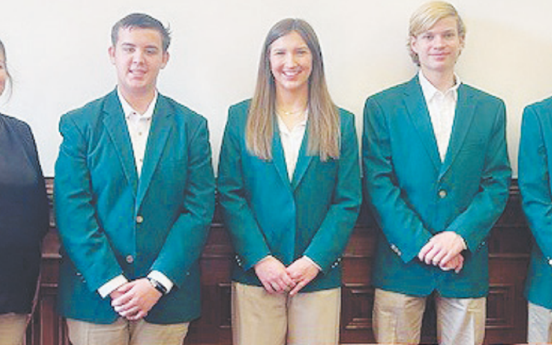 The 4H ambassadors spoke about its activities within the past quarter. Pictured from left to right are DeWitt County Extension Agent Candace Williamson and Ambassadors Gunnar Frank, Ella Jander, Andrew Hahn, and Caleb Keller.
