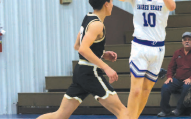 Ty Noska makes a pass vs. RT-C here Dec. 10. Chuck Grafe/Tribune-Herald