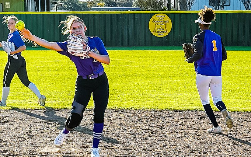 Lauren Springfield (center) and a couple of teammates go through a practice session. Photo courtesy of Howard Esse.