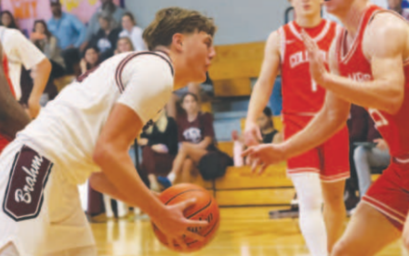 Kason Podhajsky looks for an opening in the game against Columbus. Chuck Grafe/ Tribune-Herald