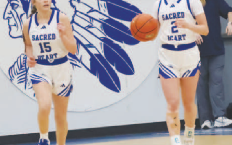 Kenzie Chance walks the ball up vs. VFA. At left is Allie Clark. Chuck Grafe/Tribune-Herald