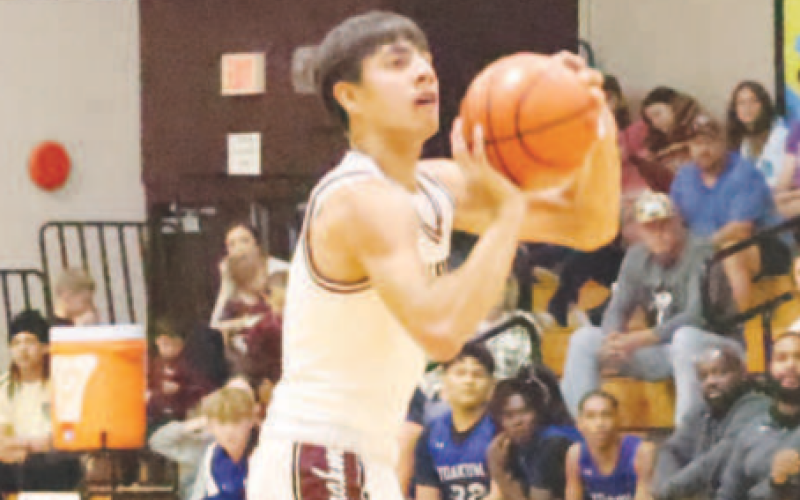 Gavyn Chapa shoots a three against Yoakum. Chuck Grafe/Tribune-Herald