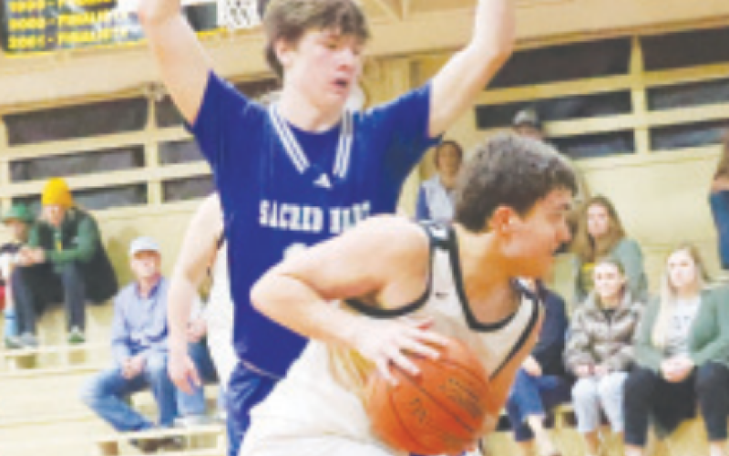 Kolby Haas guards RTC’s Cash Robertson. Chuck Grafe/Tribune-Herald