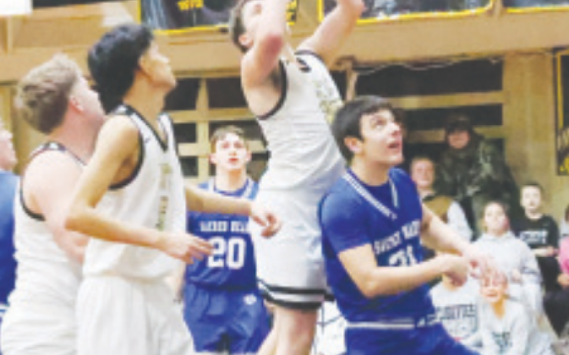 Sam Bludau (21) waits for a possible rebound. Chuck Grafe/Tribune-Herald