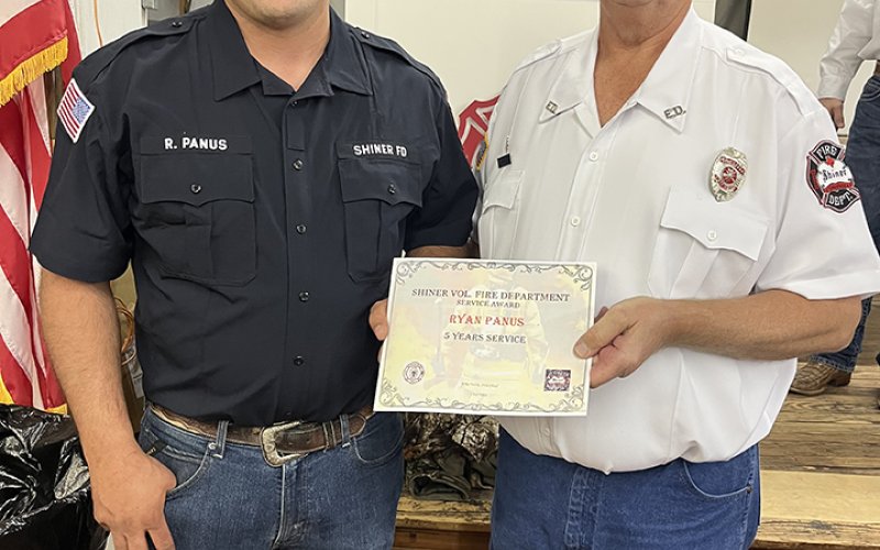 Ryan Panus (5 years), left, and Daniel Muehlstein, president of the SVFD.