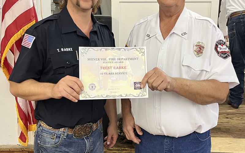 Trent Rabke (10 years), left, and Daniel Muehlstein, president of the SVFD.
