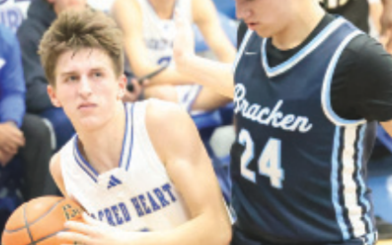 Hudson Kutac, left, in the Bracken Christian game. Chuck Grafe/Tribune-Herald