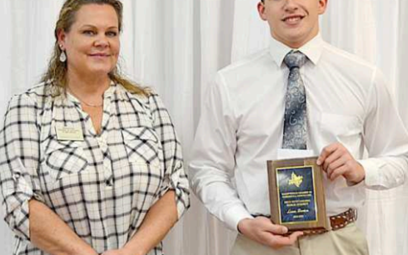 Lance Barton was presented the Outstanding Senior Student Award at the 93rd Annual Hallettsville CCA Banquet held Wednesday, Jan. 29. Barton is a senior at Sacred Heart Catholic High School. Presenting the award is Hallettsville CCA vice-president Sammi Silgero. Photo by Ani Zak