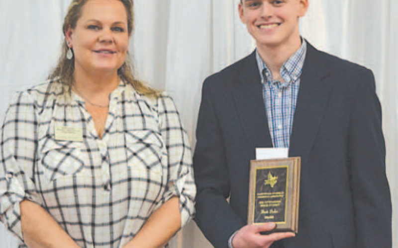 Brett Baker was presented the Outstanding Senior Student Award at the 93rd Annual Hallettsville CCA Banquet held Wednesday, Jan. 29. Baker is a senior at Hallettsville High School. Presenting the award is Hallettsville CCA vice-president Sammi Silgero. Photo by Ani Zak