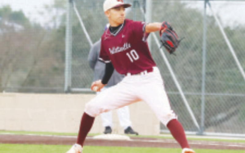 Hudson Chenard throws the first pitch of the season vs. Shiner. Chuck Grafe/ Tribune-Herald
