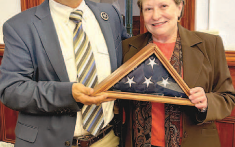 At Monday’s Lavaca County Commissioners’ Court meeting, the court acknowledged Lavaca County Sheriff’s Office employee, Darlene Stacy, who is retiring after 20 years of dedicated service. Stacy was presented the United States flag encased in a wooden frame. The flag had flown over the Lavaca County Courthouse and was folded by Hallettsville Cub Scout Pack 223. Sheriff Steven Greenwell (left) presents Stacy with the flag. Photo by Jimmy Appelt