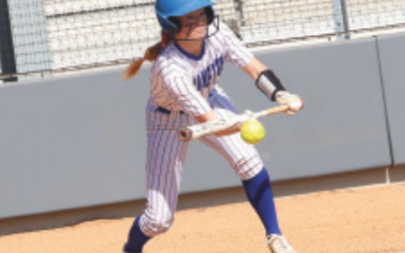 Kenzie Chance puts down a bunt in the Hyde Park game. Chuck Grafe/Tribune-Herald