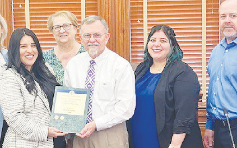 A Certificate of Achievement was given to County Auditor Neomi Williams for excellence in financial reporting. Pictured from left to right are members of the Auditor's Office Melissa Terry, County Auditor Neomi Williams, Candy Frady, Judge Daryl Fowler, Cindy Maurer, and Michael Dietzel.