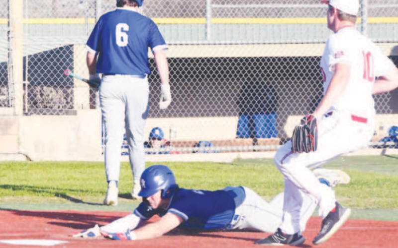 Josh Terry scores on a passed ball in the victory over St. Paul. Mark Lube/Shiner Gazette