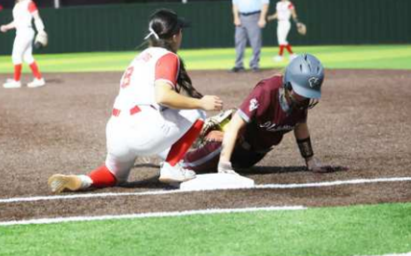Taylor Yeatts dives safely back to first on a pick-off attempt in the Columbus game. Chuck Grafe/Tribune-Herald