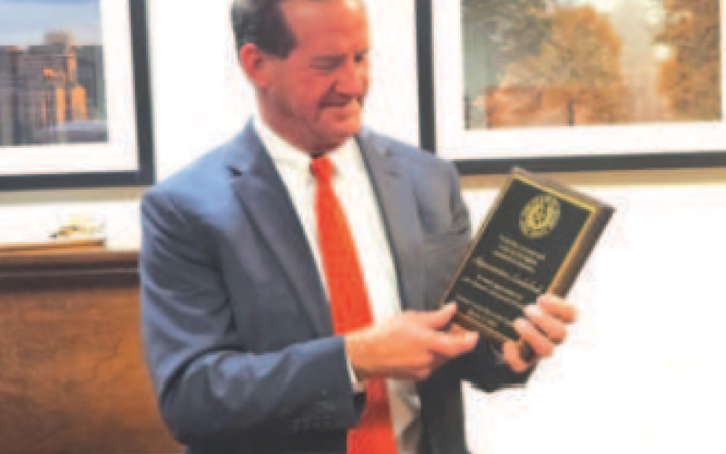 District 30 state representative A.J. Louderback displays plaque presented to him at the Lavaca County Day at the Capitol from the county