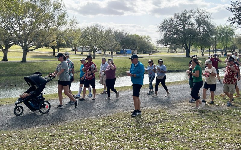 Participants enjoy refreshments while walking in Green-Dickson Park. Staff photo.