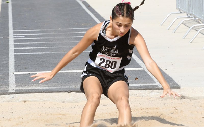 Mina Tinajero got a best jump of 16 feet, 5 inches to win the long jump. Photo by Mark Lube.