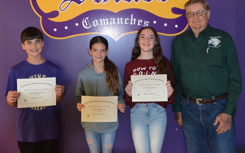 Lavaca Soil and Water Conservation District 13 selected its 13 and under essay winners from Shiner ISD, who include from left Lyndon Leal (1st), Renee Johnson (2nd) and Piper Wallace (3rd) and LSWCD director James Steffek. Photo by Jimmy Appelt