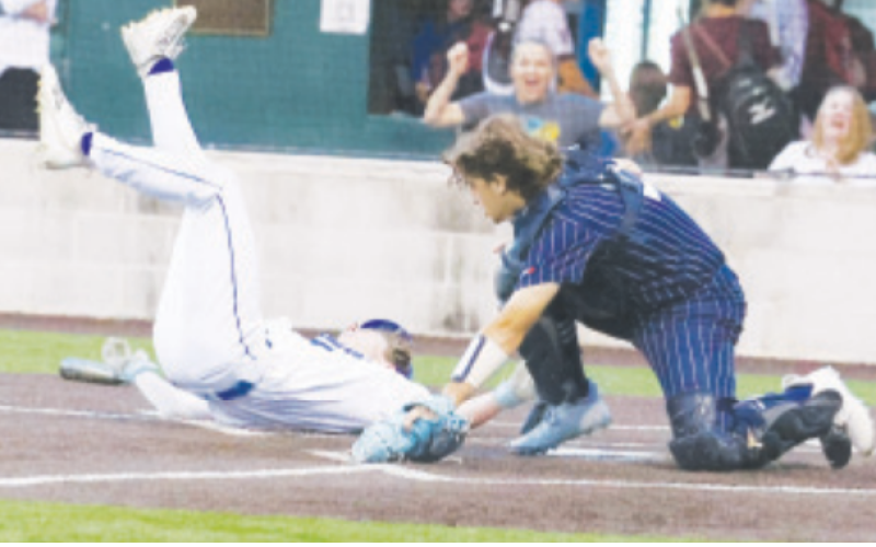 Ty Noska scores on a wild pitch in the Bracken Christian victory here Tuesday, March 25. Chuck Grafe photo