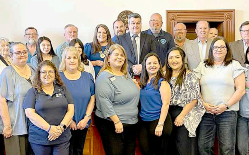 A large group representing various organizations and agencies, who work toward the prevention of child abuse pose for a photo with the Lavaca County Commissioners’ Court at its Tuesday, March 25 meeting. The court approved a proclamation declaring April as Child Abuse Prevention Month. Photo by Jimmy Appelt