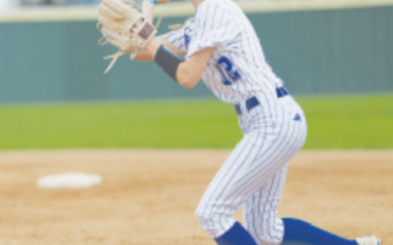 Indianette second baseman Madelyn Kurtz throws out a runner at first. Photo by Chuck Grafe