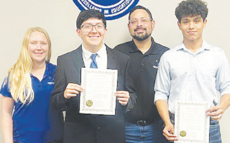 Two students received proclamations for All State Band. Pictured from left to right are Assistant Band Director Cait Kosch, Solo and Ensemble Piano All State winner Gael Castillo, Band Director Mario Morales, and French Horn All State winner Luis Richardson.