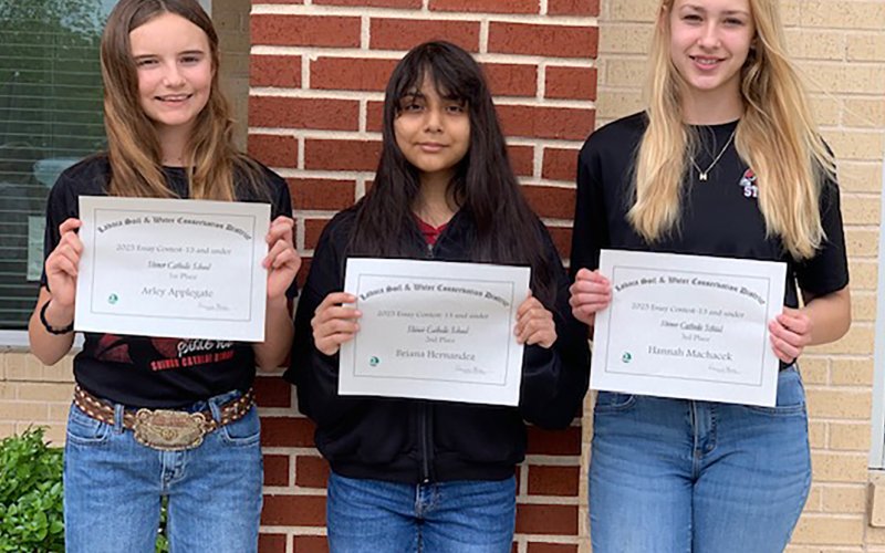 Lavaca Soil and Water Conservation District 13 selected its school-wide 13 and under essay winners from Shiner Catholic School, who include from left Arley Applegate (1st), Briana Hernandez (2nd) and Hannah Machacek (3rd). Applegate’s essay placed second at district in the 13 and under division.