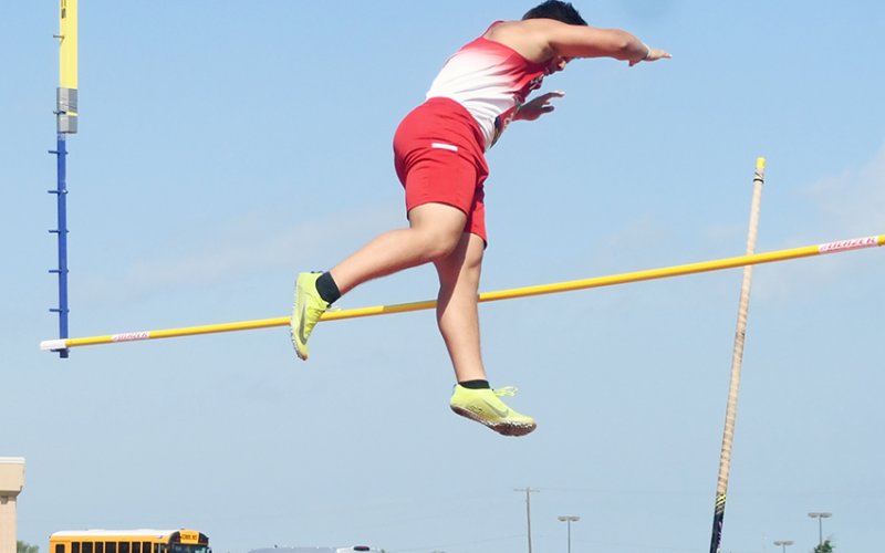 Sam Perez clears the bar during the pole vault. He reached 10 feet, 6 inches to place fourth. Photo by Mark Lube.