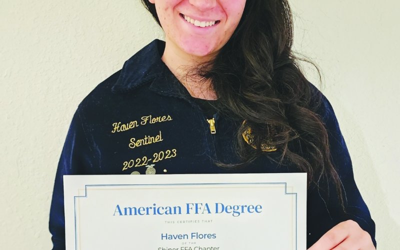 Haven Flores proudly displays her American FFA degree, the highest honor awarded by the National FFA Organization.