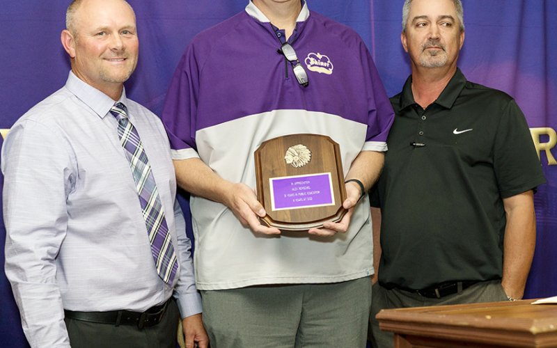The athletic department and Shiner Athletic Booster Club presented an appreciation award to retiring Shiner ISD Superintendent Alex Remschel (center). Also shown areDaniel Boedeker (athletic director, left) and Tommy Schuette (Shiner Booster Club President, right). Photo courtesy of Photos by Lori Raabe.