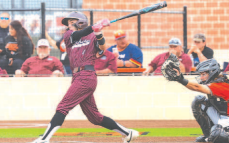 Brock Bludau watches his home run sail over the left field fence in the 2-1 Game 1 victory. Photo by Chuck Grafe