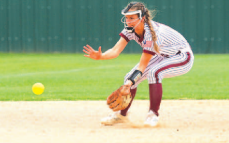 Lady Brahmas shortstop Macey Pustka scoops up a ground ball.. Photo by Chuck Grafe