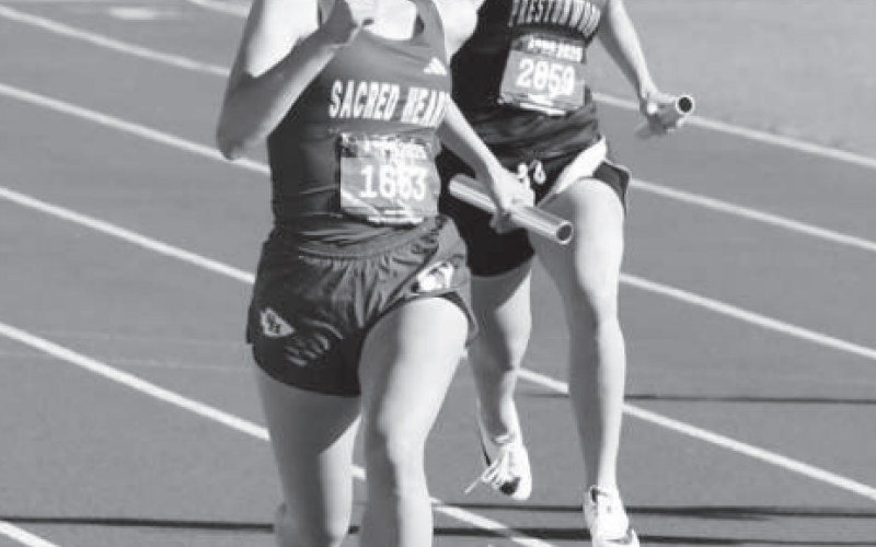 Hallie Taylor in the 800 relay. Photo by Karen Janak