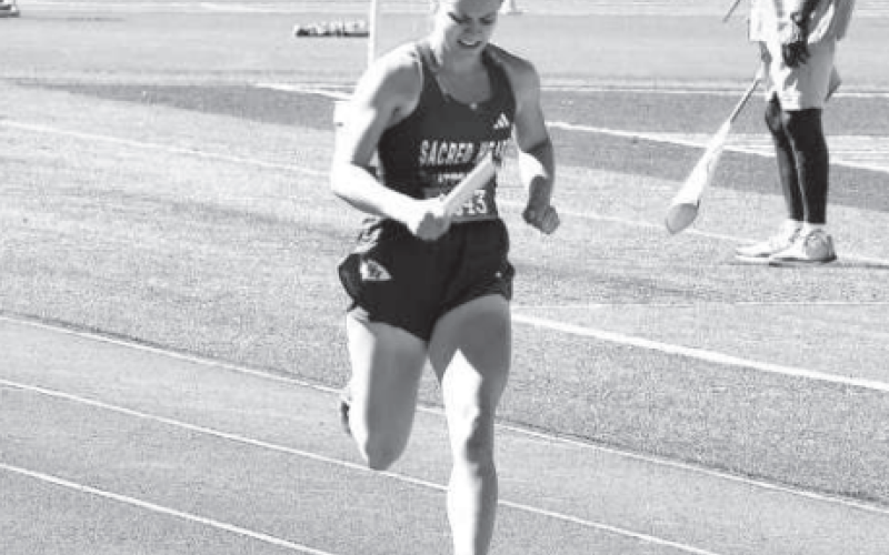 Karley Kostelnik ran on all three relays. Photo by Karen Janak