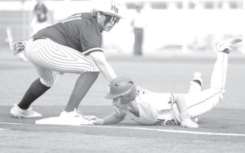 Brahma first baseman Austin Henrichs couldn’t get the tag down on time on Marion’s Gage Hamilton in Game 2 in Marion Friday. Photo by Chuck Grafe