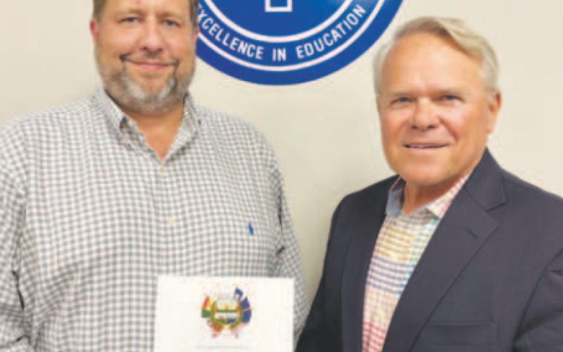 Rodney Svec took the administrator Oath of Office at the May 12 Yoakum ISD School Board meeting. Pictured from left to right are Svec and Yoakum ISD School Board President Glen Kusak