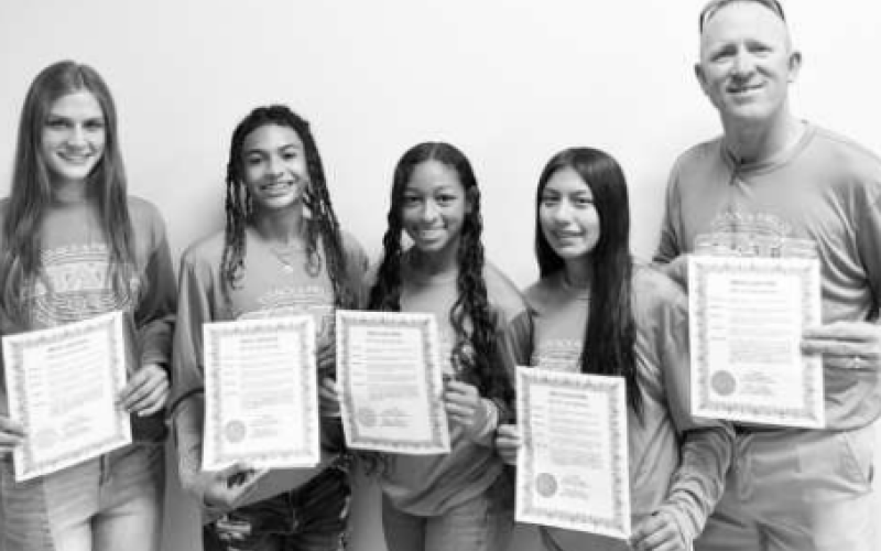 Pictured from left to right are Sam Adamek, Jayla Hessler, Valentina Hopkins, Makayle Olmedo, and Yoakum High School (YHS) Lady Bulldog Track Coach Dennis Muehlstein. The team placed 7th in the 4x200 meter relay at the State Meet.