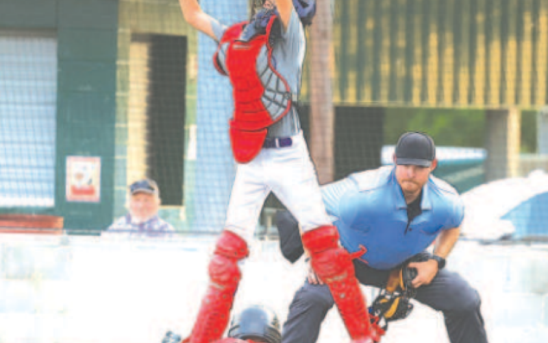 Ty Rother scores on an error in the Tuesday, May 20 game here. Photo by Chuck Grafe