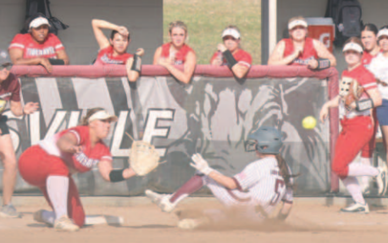 Hanna Zachary, sliding into third with a triple against Columbus April 9, was named Defensive Player of the Year. Photo by Chuck Grafe