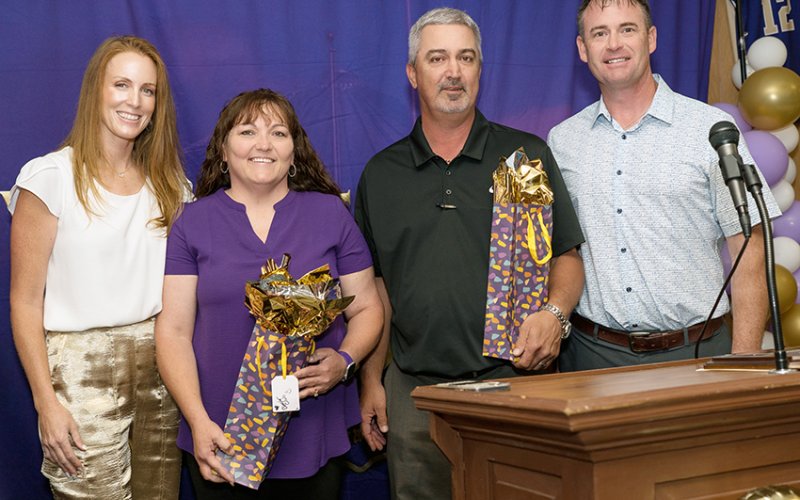 The Shiner Booster Club gave a gift in appreciation for their service to outgoing members Secretary Shawna Lehnert (second from left) and President Tommy Schuette (second from right). Also shown are Carissa Christensen (Booster Club member,left) and Randy Christensen (Booster Club member, right).Photo courtesy of Photos by Lori Raabe.