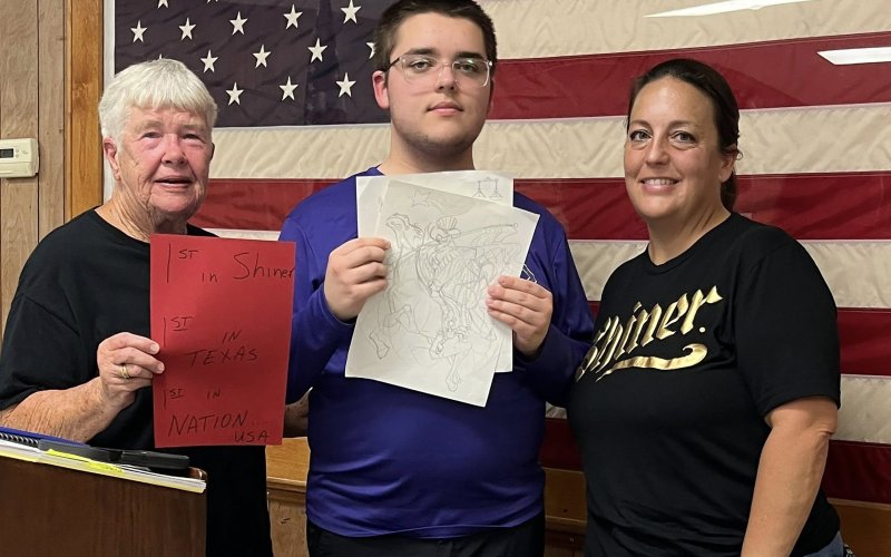 Pictured are, left to right, Shiner VFW auxiliary member JoAnn Muehlstein, John Moore and Meagan Moore.