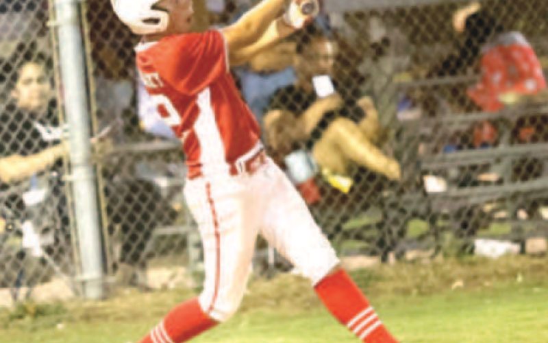 Photo by Chuck Grafe Carter Podhajsky watches his home run fly over the centerfield fence in the victory over Luling.