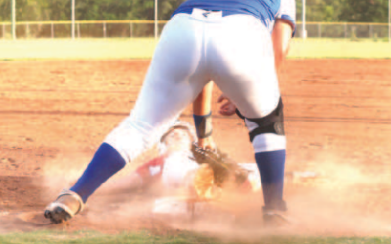 Photo by Chuck Grafe Brenna Bucek slides into third during the win over Yoakum Saturday. Brenna went 2-for-3 in the game.