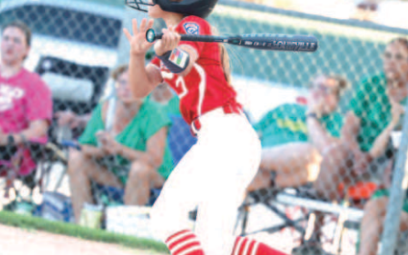 Photo by Chuck Grafe Braylee Hanslik watches her hit go into right field vs. Cuero.