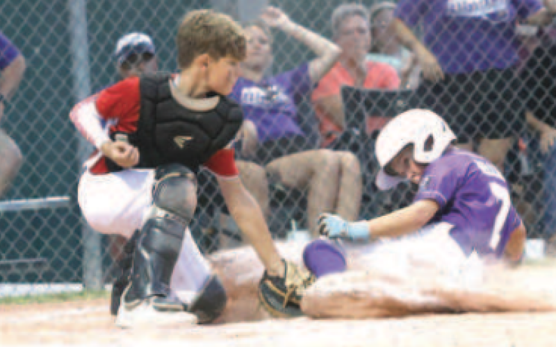 Photo by Chuck Grafe Catcher Jase New tags out Shiner’s Kannon Keller in the Wednesday, June 18 game.