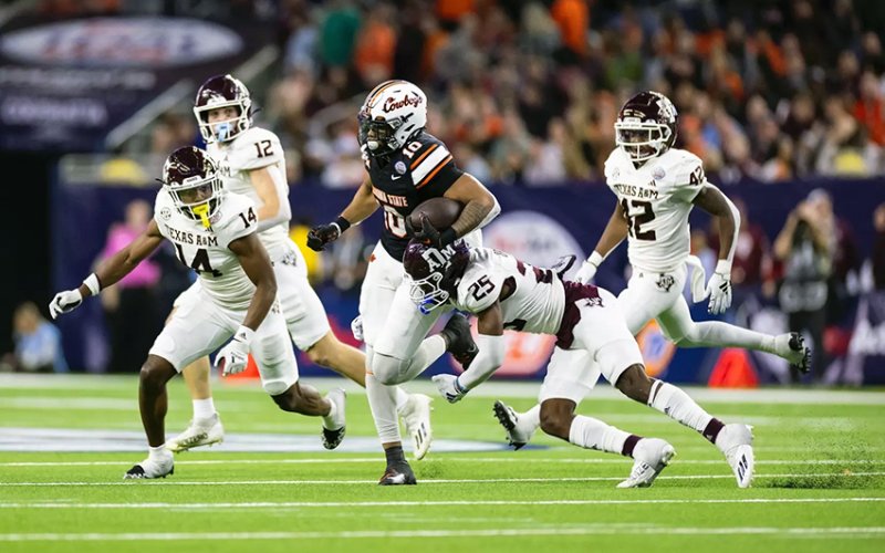 Shiner graduate and Texas A&amp;M defensive back Dalton Brooks (25) attempts to make a stop during the 2023 Texas Bowl against Oklahoma State during his freshman season. Brooks played every game in his sophomore year in 2024 for the Aggies. Photo courtesy of Craig Bisacre/Texas A&amp;M Athletics.