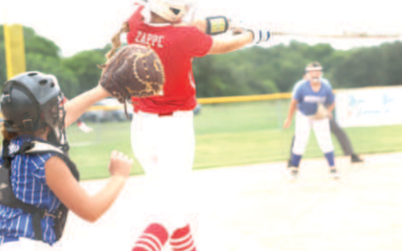 Photo by Chuck Grafe Adley Zappe at bat in the July game against Needville.