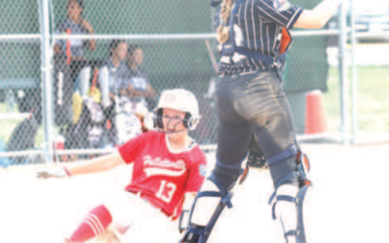 Photo by Chuck Grafe Blair Ranly scores on an inside-the-park homer during the victory over Sinton.